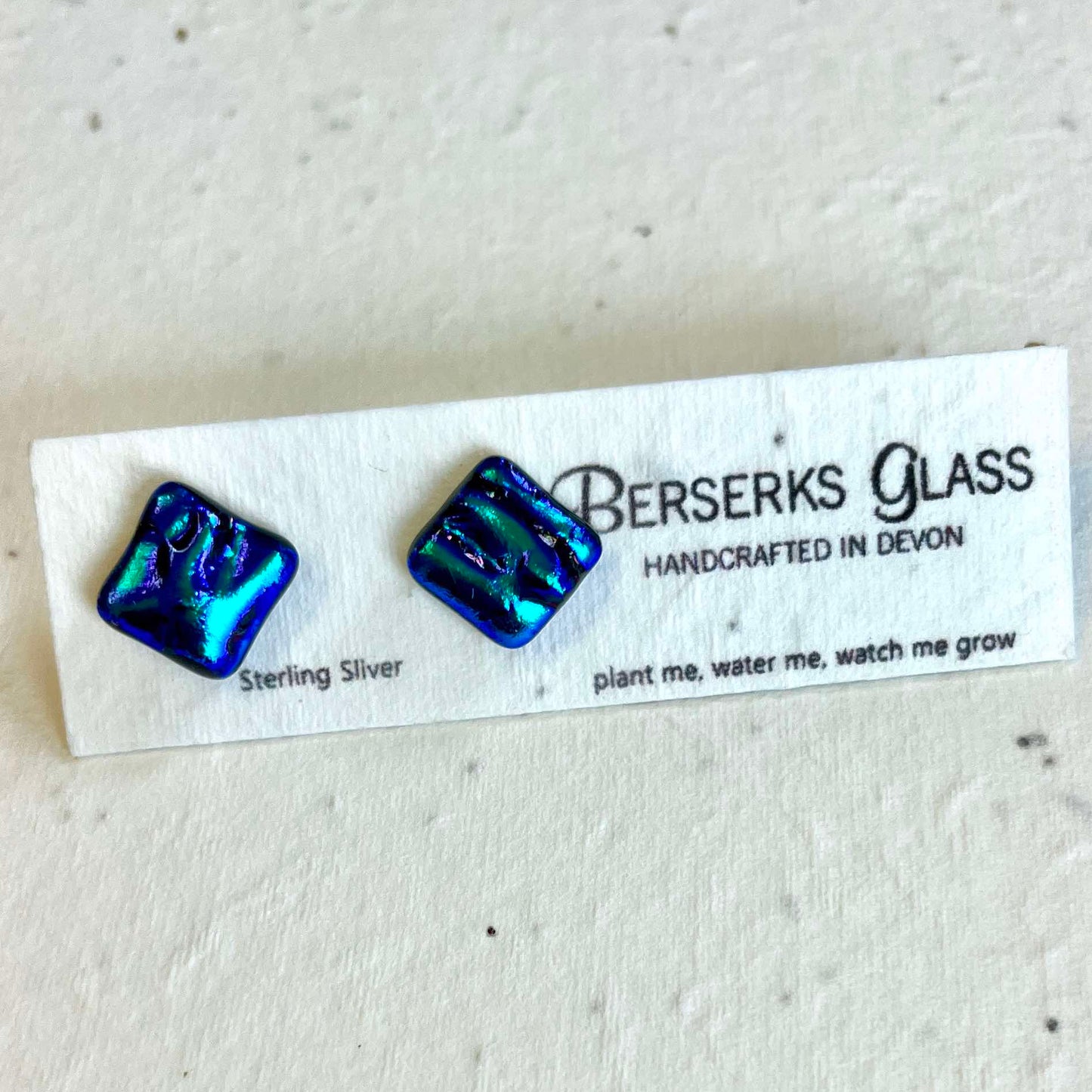 Dazzle Studs in sterling silver and crafted with fused dichroic glass