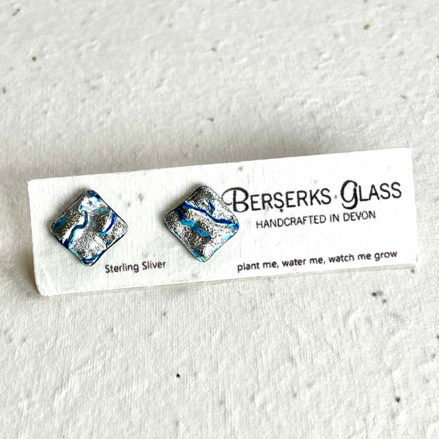 Dazzle Studs in sterling silver and crafted with fused dichroic glass