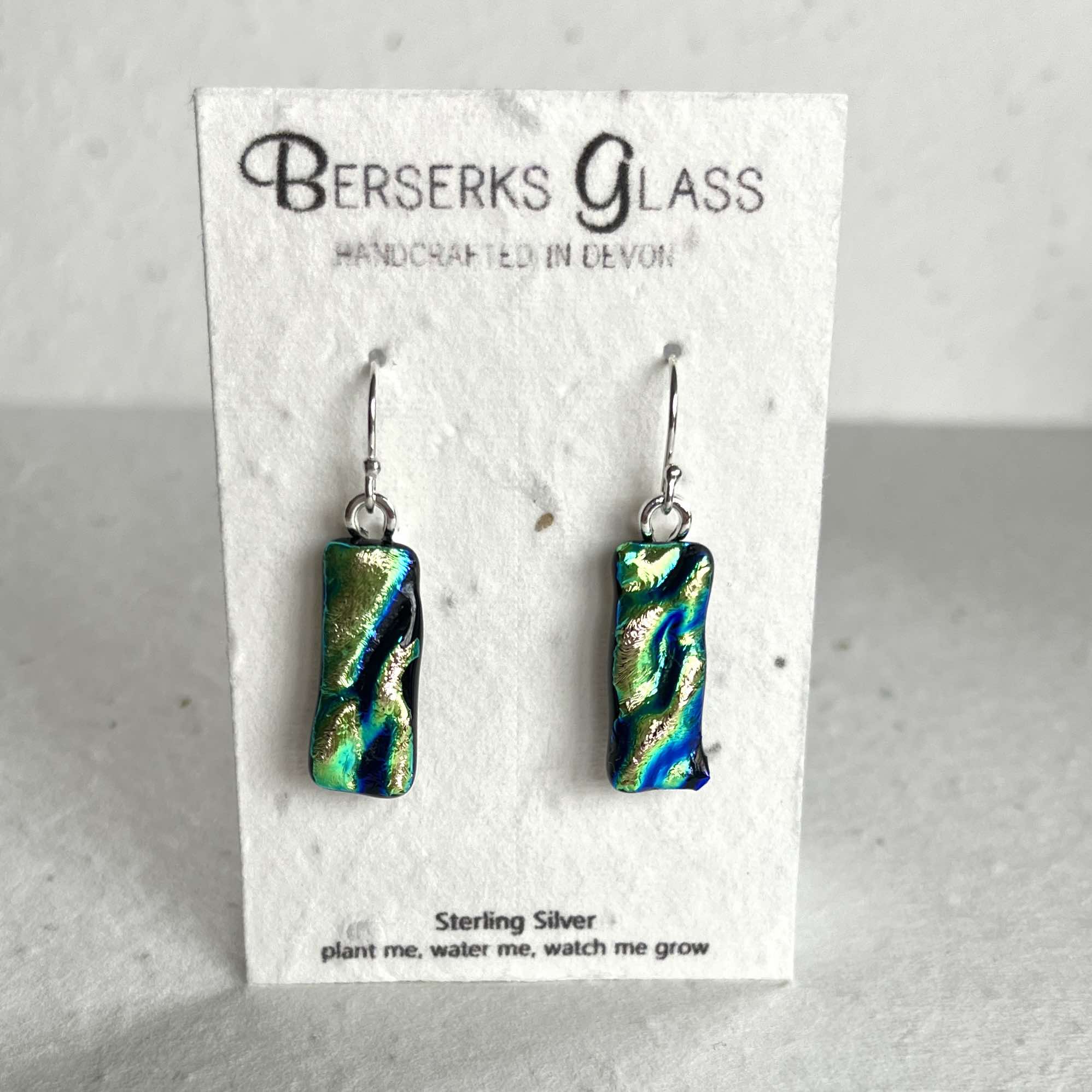 Dazzle long drops in sterling silver and crafted with fused dichroic glass