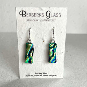 Dazzle long drops in sterling silver and crafted with fused dichroic glass