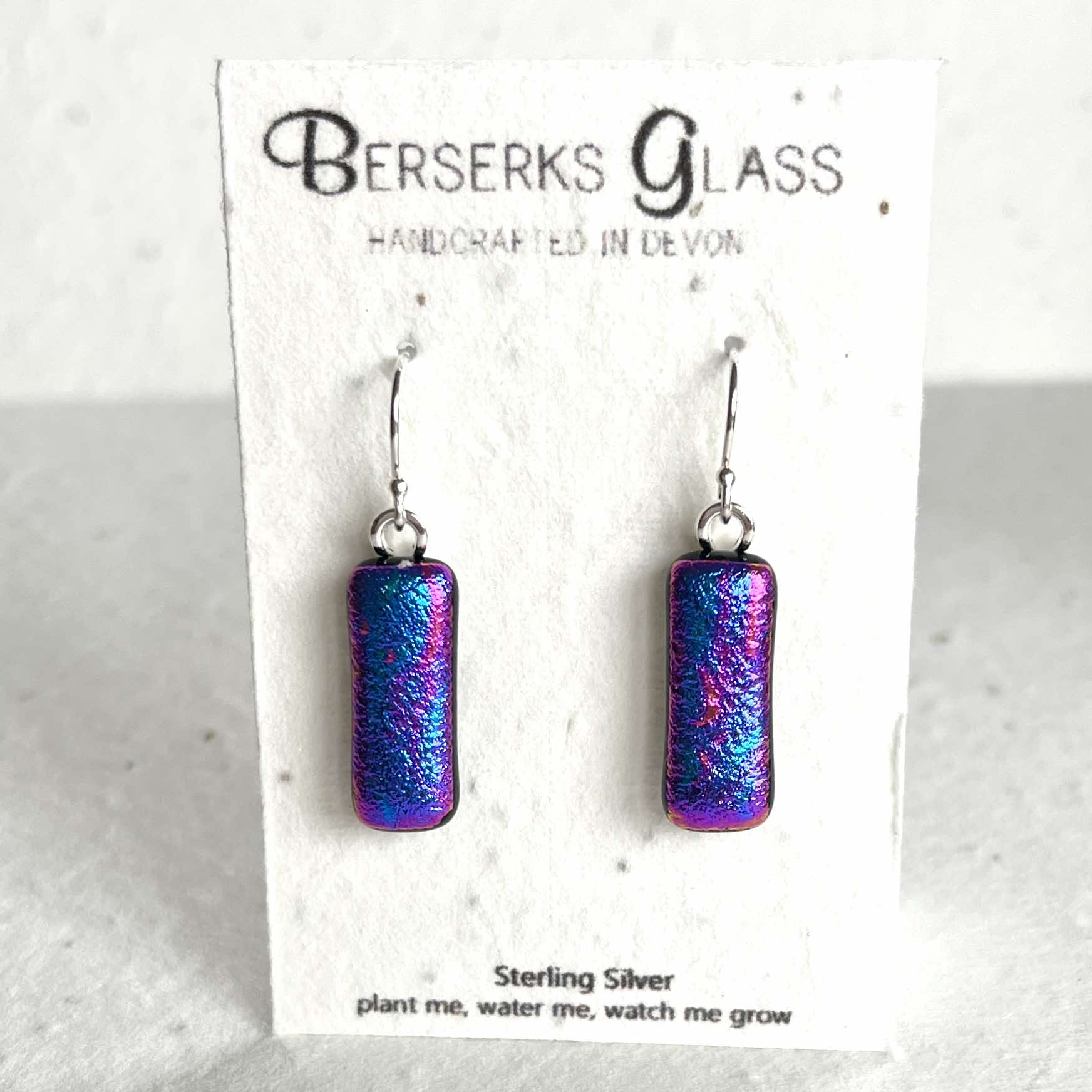 Dazzle long drops in sterling silver and crafted with fused dichroic glass