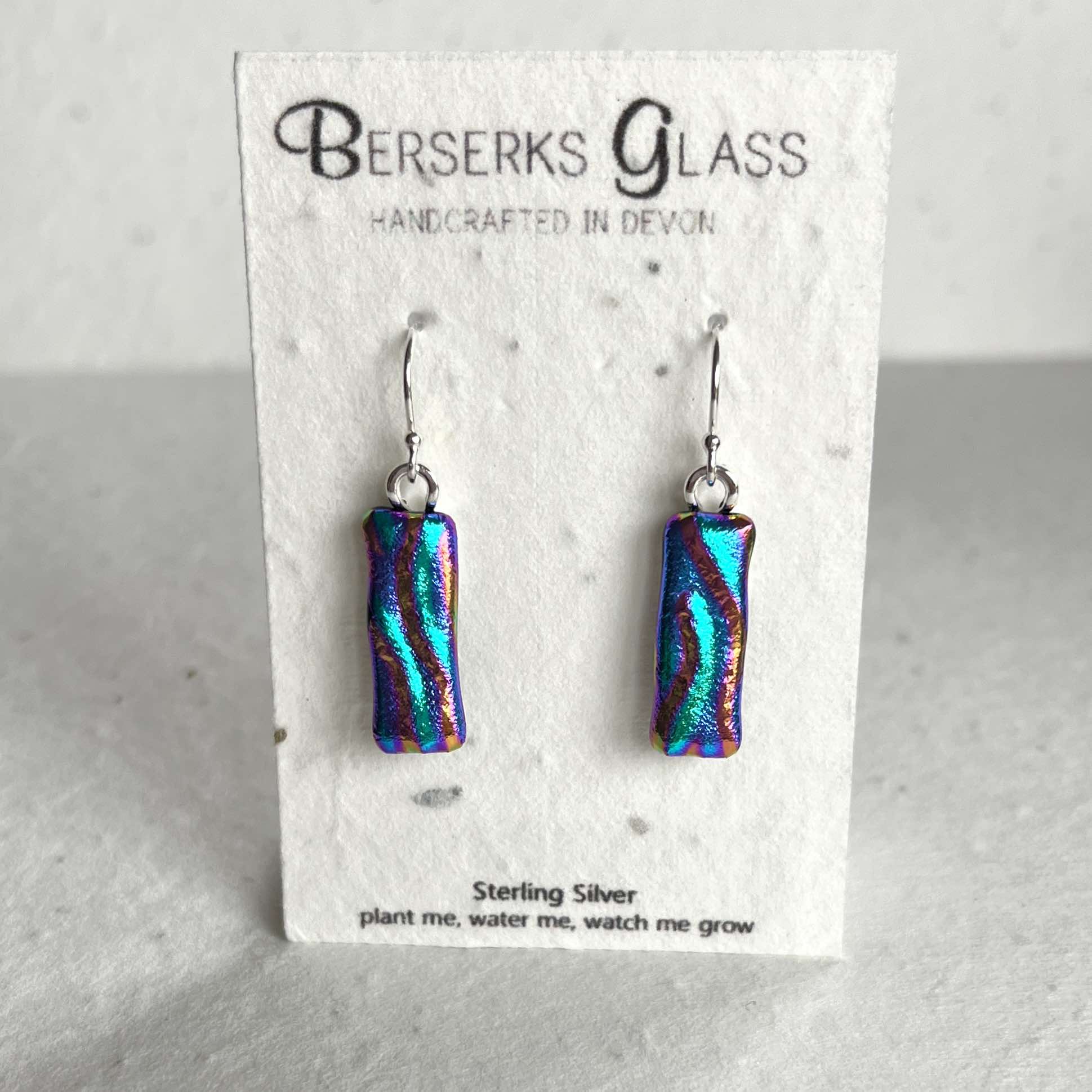 Dazzle long drops in sterling silver and crafted with fused dichroic glass