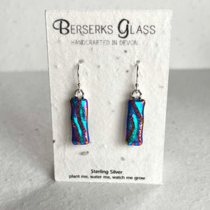 Dazzle long drops in sterling silver and crafted with fused dichroic glass