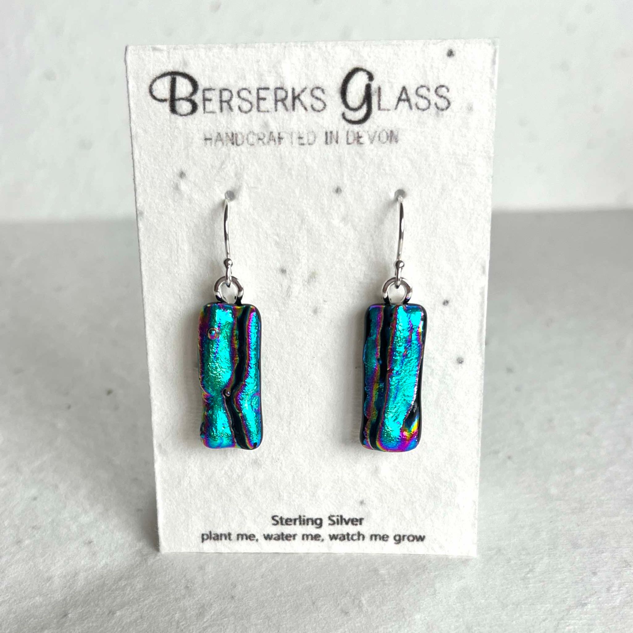 Dazzle long drops in sterling silver and crafted with fused dichroic glass