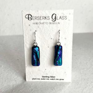 Dazzle long drops in sterling silver and crafted with fused dichroic glass