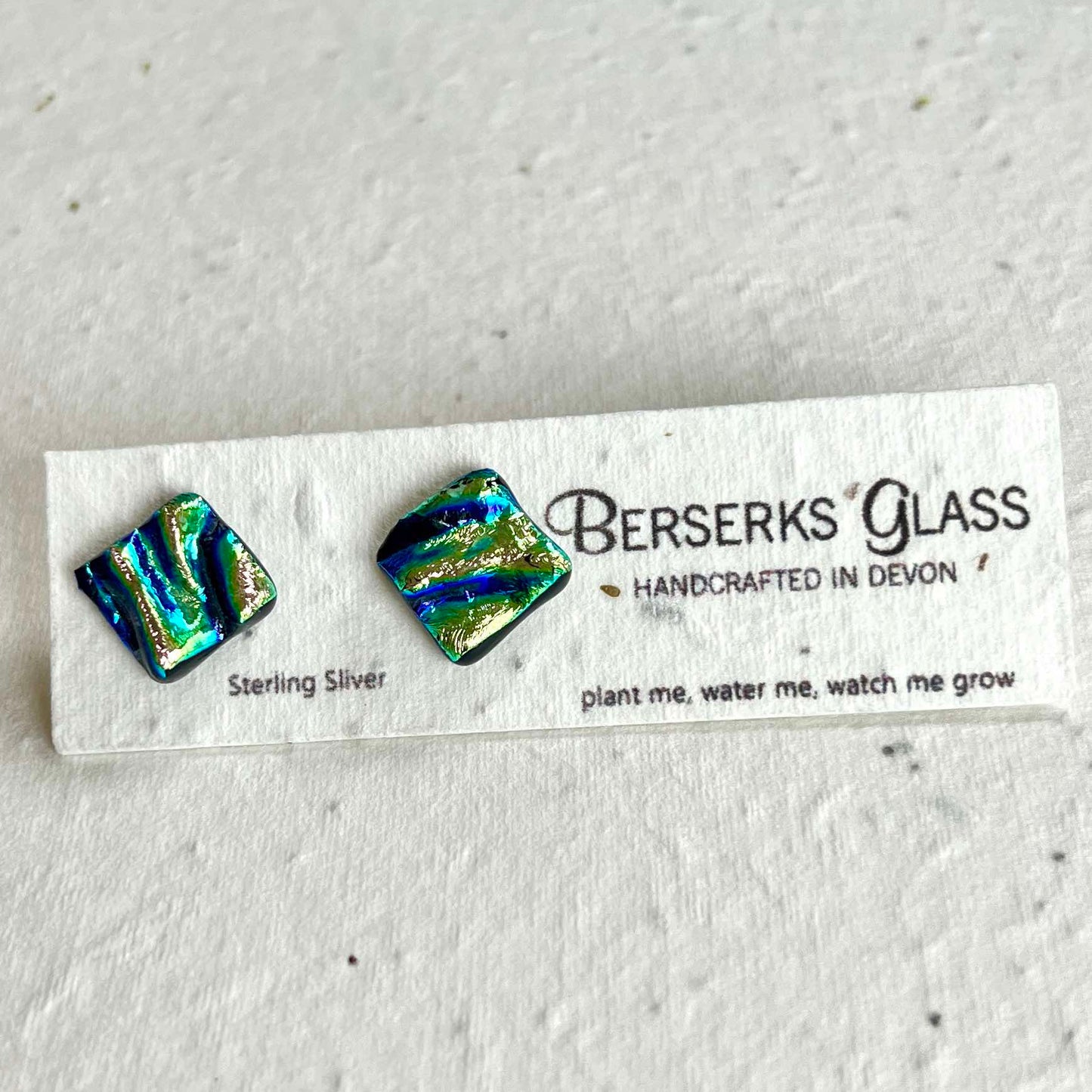 Dazzle Studs in sterling silver and crafted with fused dichroic glass