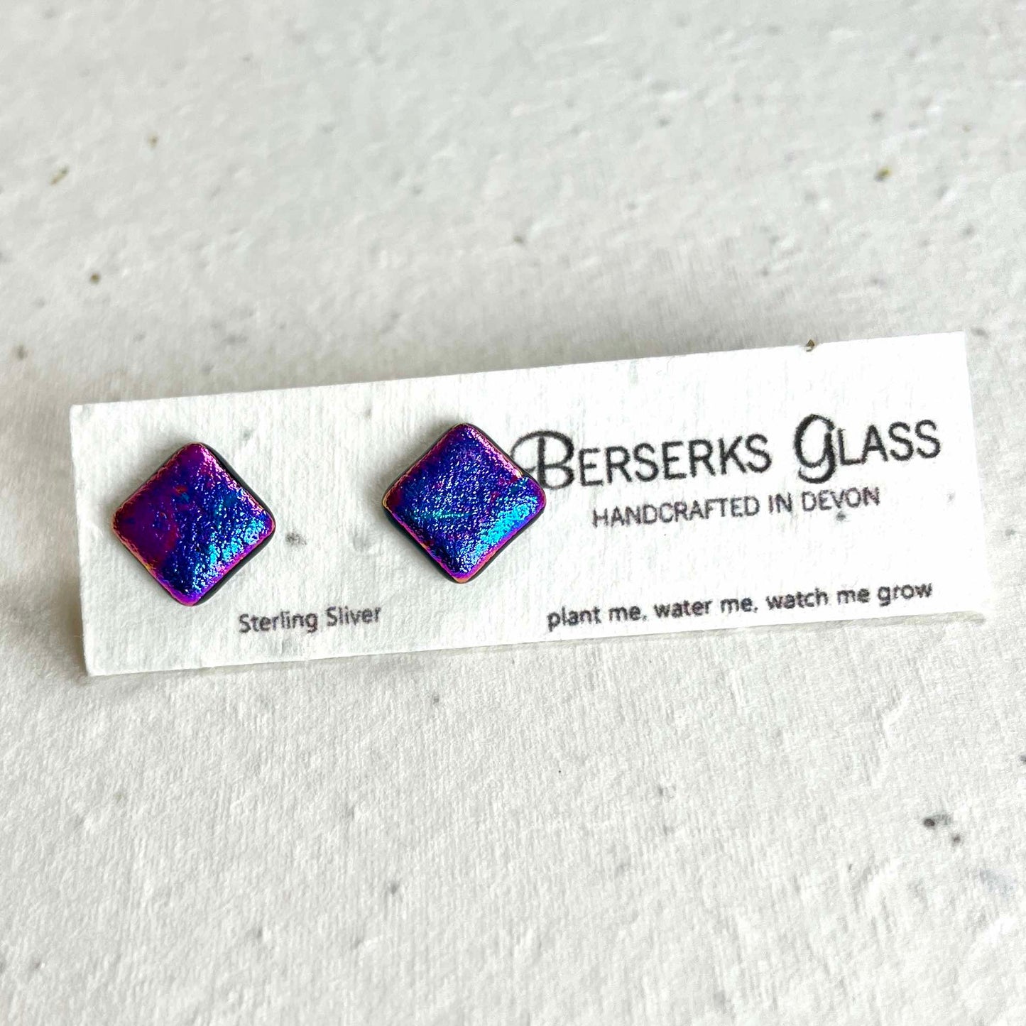 Dazzle Studs in sterling silver and crafted with fused dichroic glass