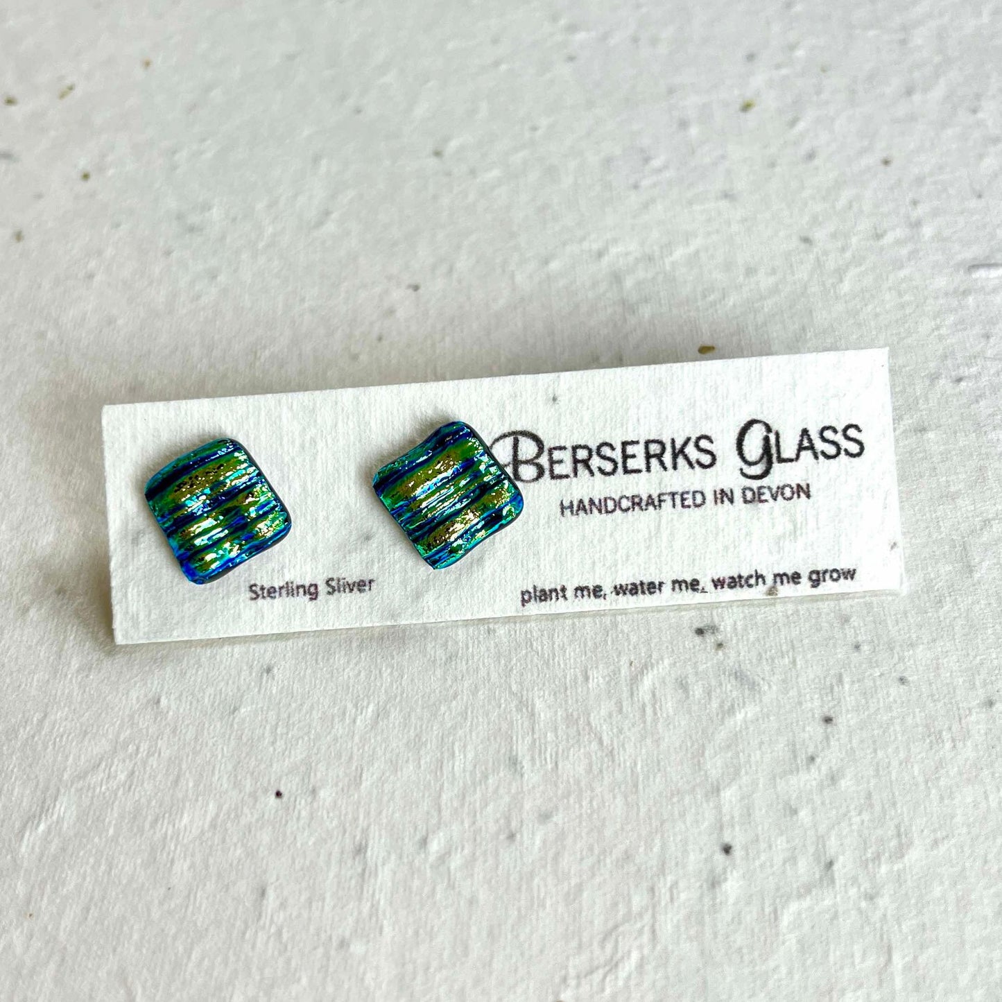 Dazzle Studs in sterling silver and crafted with fused dichroic glass